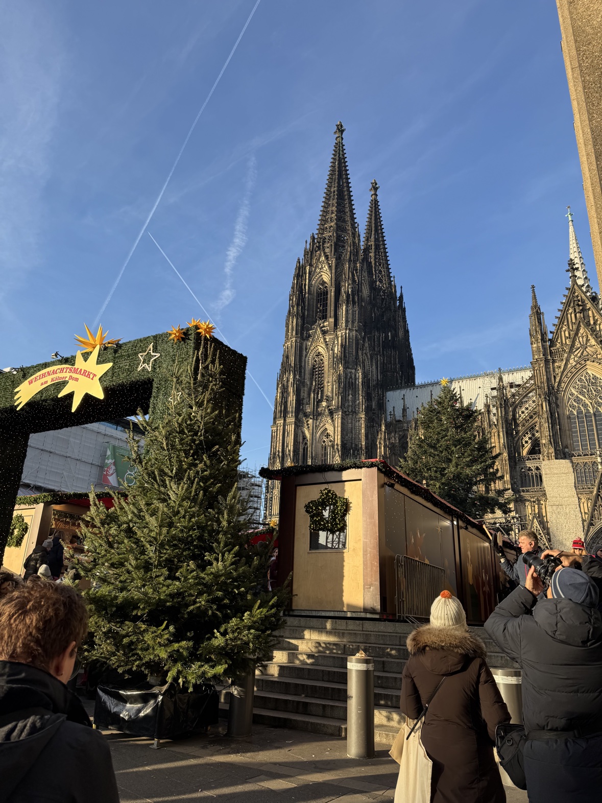The entrance arch of the Christmas market at Cologne Cathedral, Germany, with the cathedral towers rising behind