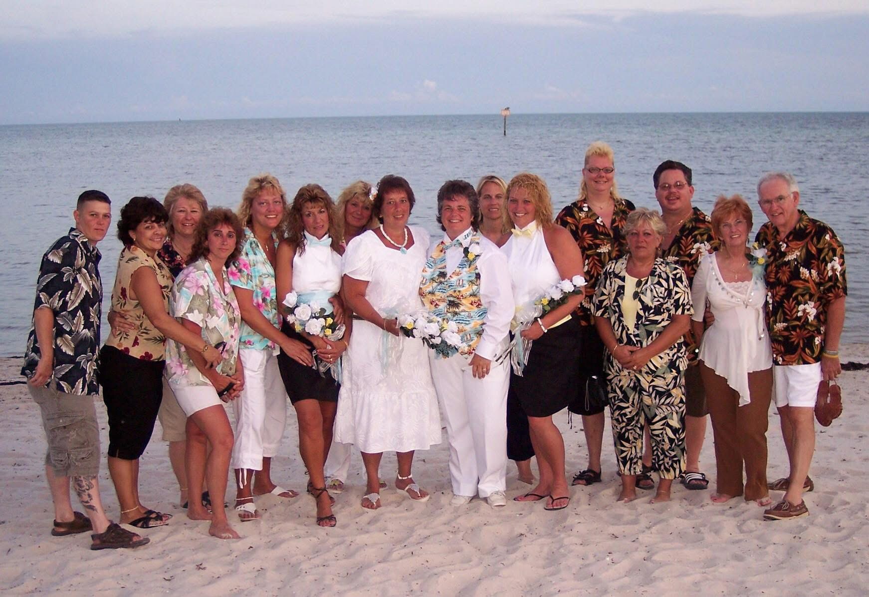Anne and Kathy surrounded by friends and family on the beach in Key West at their 2007 celebration